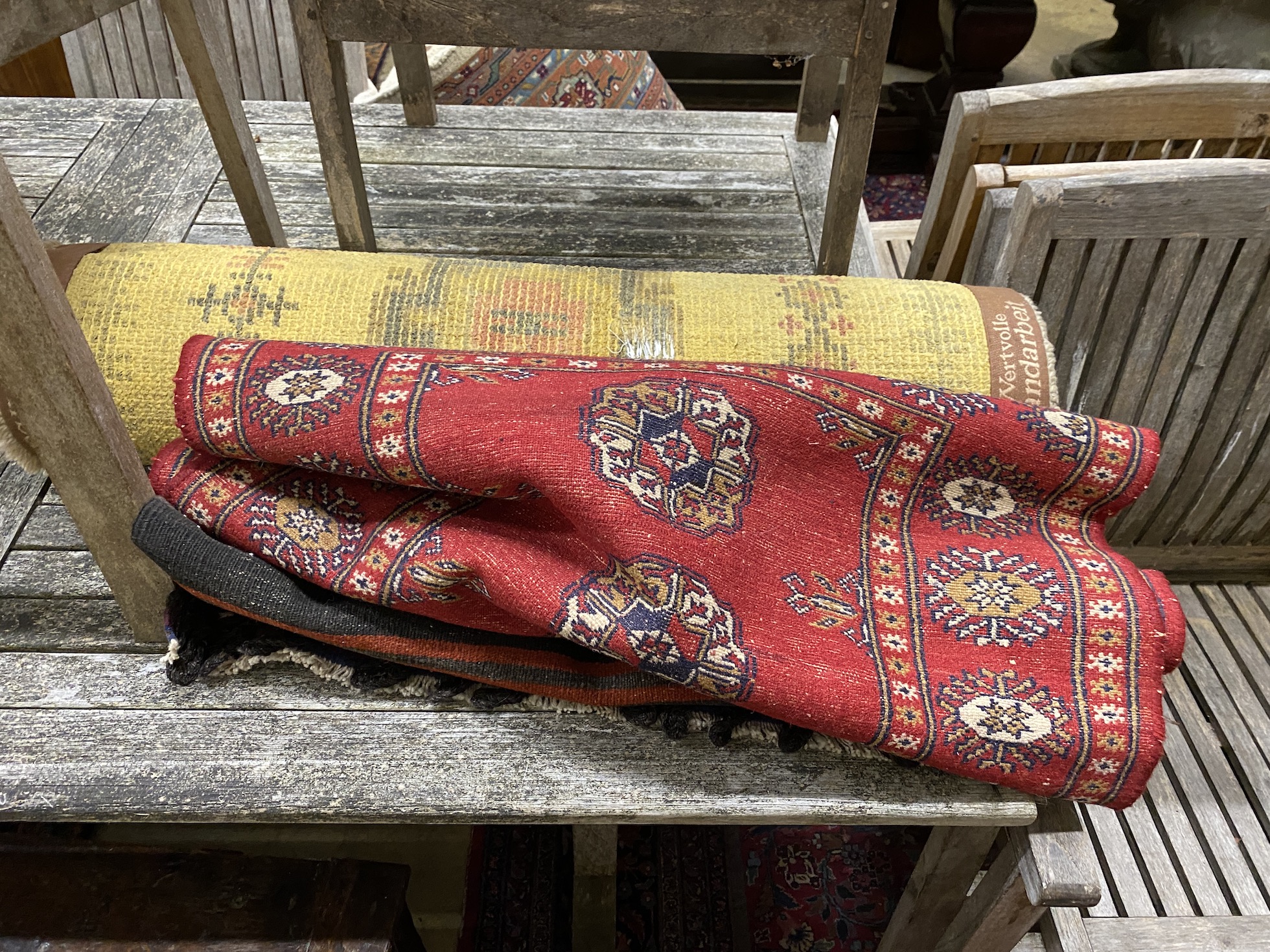 A polychrome flatweave rug, 120 x 70cm together with a Bokhara style rug and one other